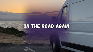 On the road again, with a photo of a white cargo van parked next to a small beach at sunse